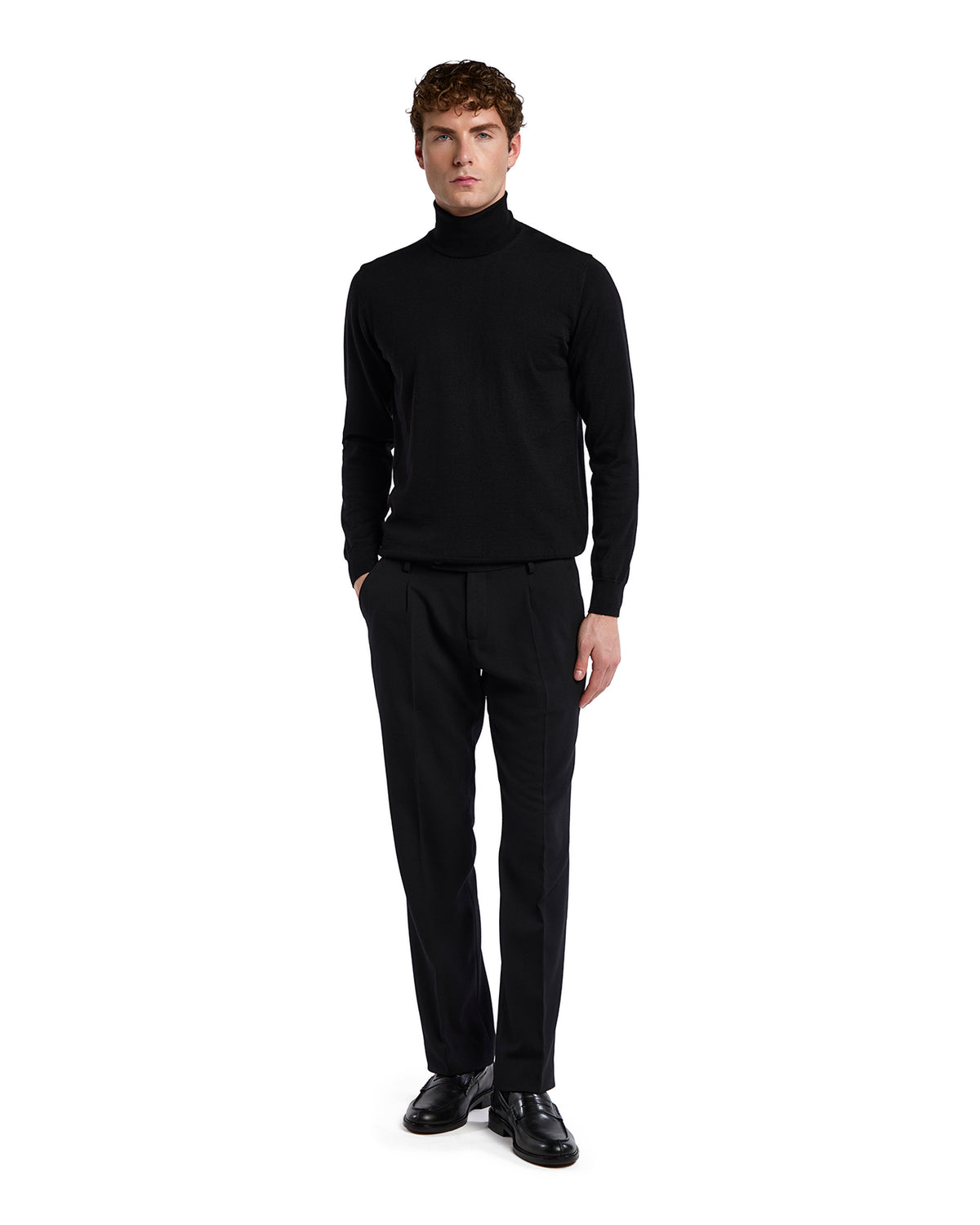 Men's black turtleneck sweater in soft knit paired with black tailored trousers for a sleek, sophisticated look.